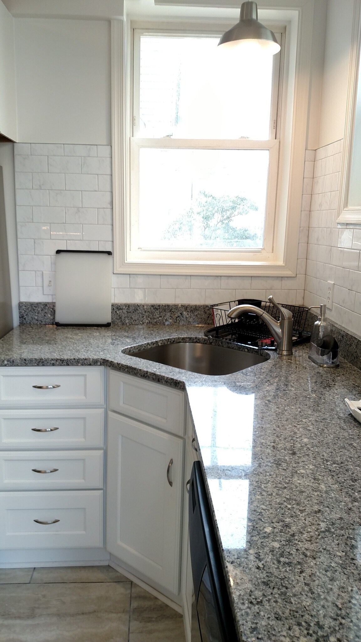 Kitchen sink and disposal. - 2509 10th St NE