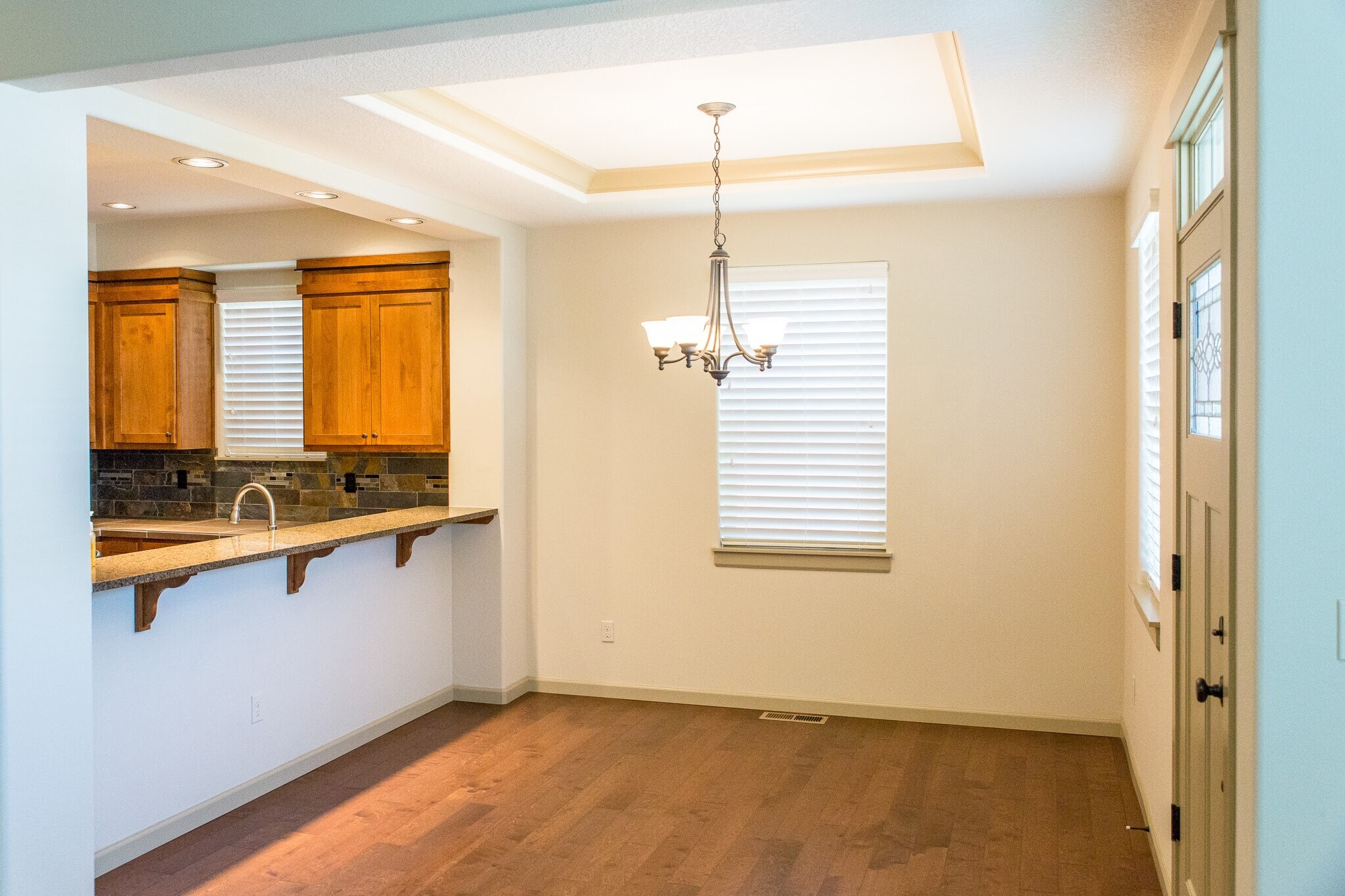 Dining Room with coffered ceiling and dimmable chandelier. - 263 NE 66th Ave