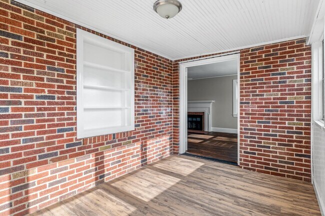 Building Photo - SW, Large Brick Two Bedroom PLUS Two Sun-Rooms, Hardwoods, LR & Separate DR, Fire Place!