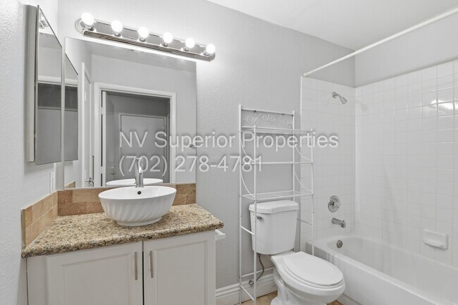 Building Photo - SW!!! 2 Bedroom Condo 1st Floor!! 2 Garage!! Gated!! Community Pool!! Fitness Room!! 2 Primary Be...