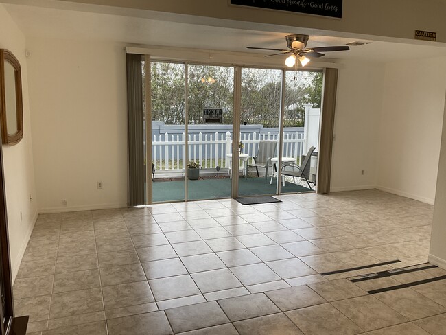 Family Room with Patio View - 329 Orchid Dr