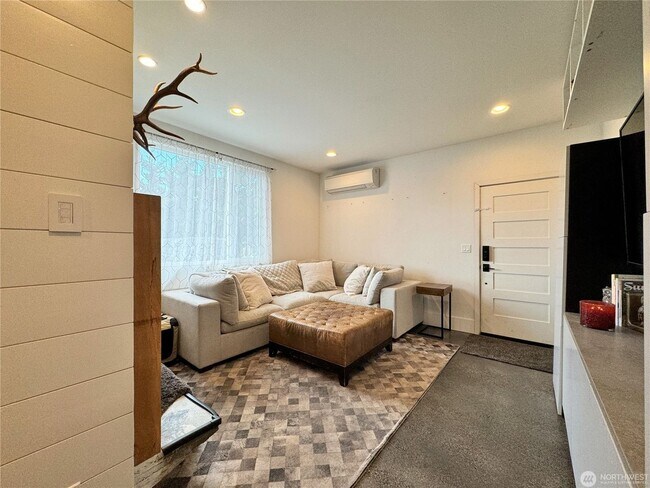 Building Photo - Remodeled 3 bdrm home on a large lot with 500 sq ft wrap around deck!
