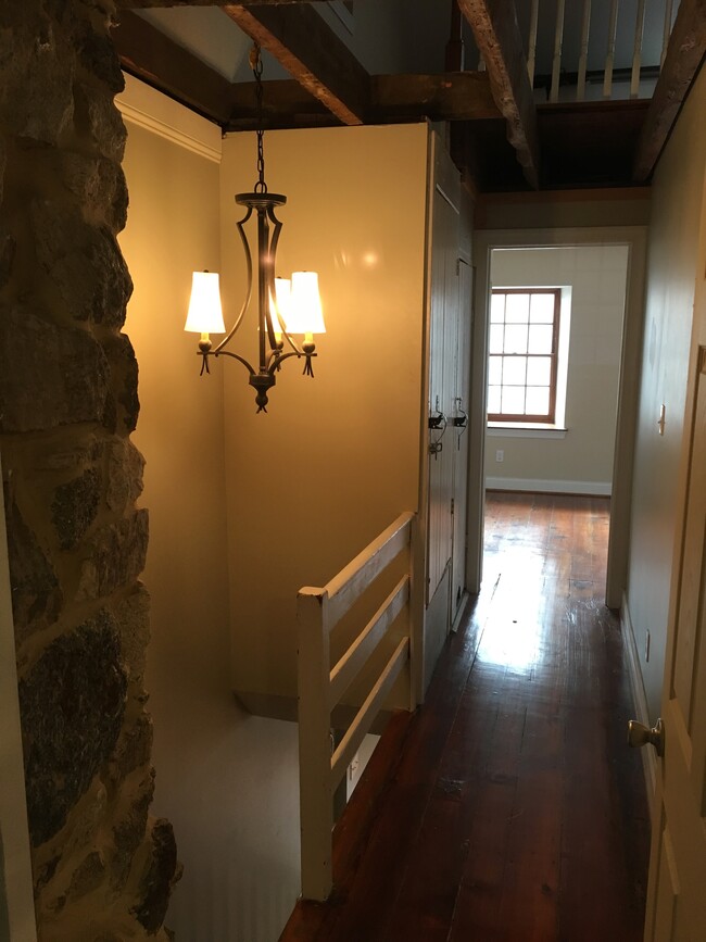 Third floor hallway between master bedroom and guest bedroom - 8198 Main St