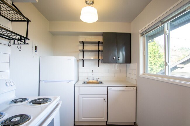 Building Photo - FREE RENT: Renovated Mid-Century 2Bdr w/Hardwoods, Dishwasher + Pets OK