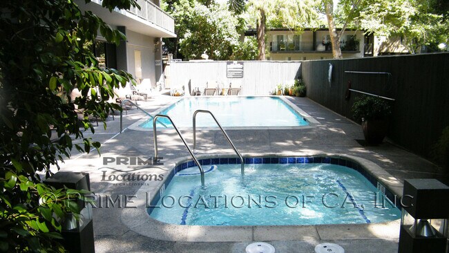 Building Photo - Experience Downtown Living with this upgra...