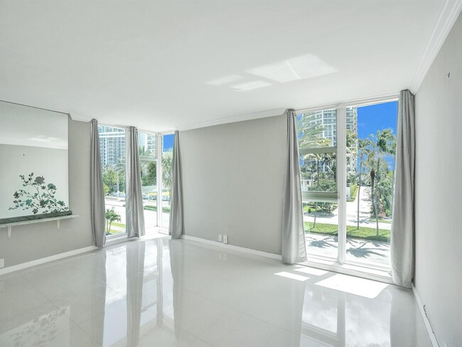 Building Photo - 10210 Collins Ave