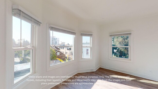 Sunlit room with windows and wood-like flooring - 2410 Dwight Way