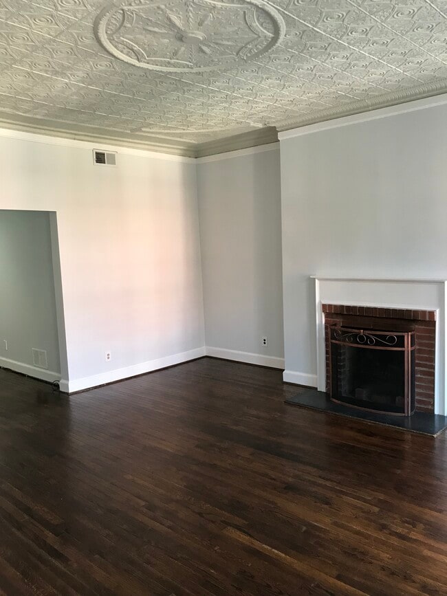 Family room; Hardwood floors with fireplace - 918 N. Calvert Street