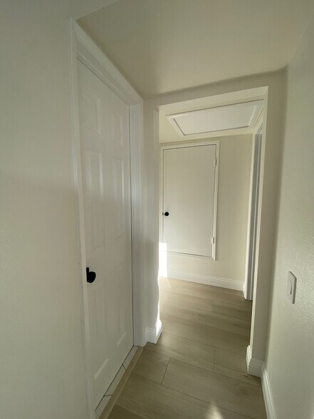 Hallway toward bedroom (the small door is utility closet) - 26541 Avenida Veronica