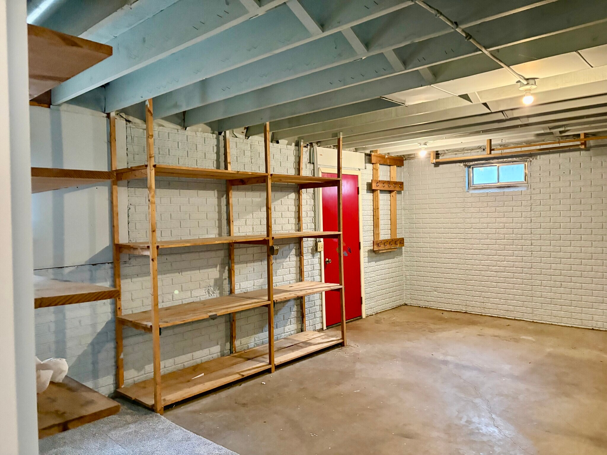 Storage area in finished side of lower level - 3885 Tam O Shanter Dr N