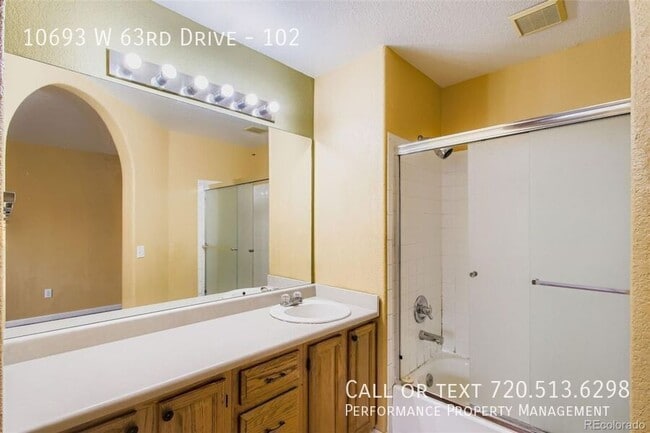 Building Photo - 10693 W 63rd Dr