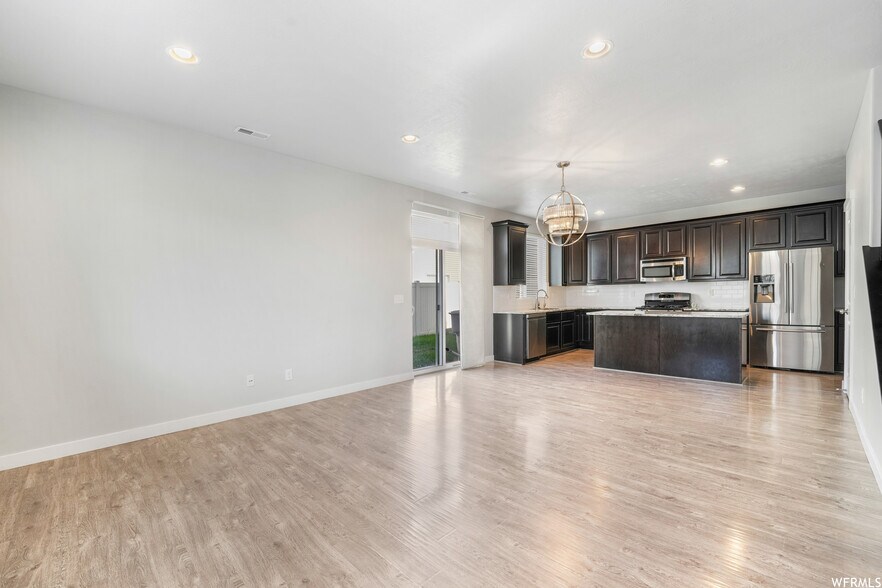living room and kitchen - 929 W Stonehaven Dr