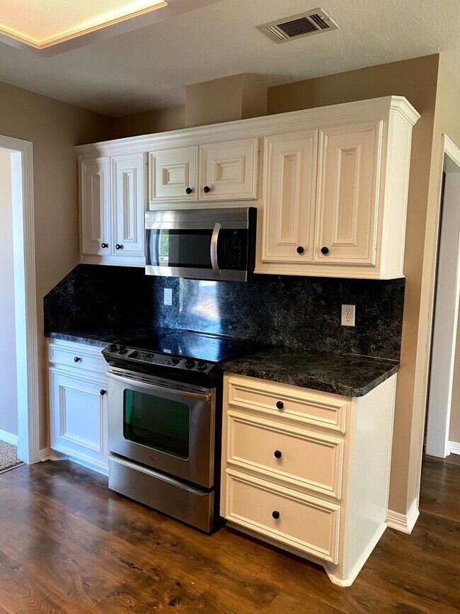 Building Photo - FABULOUS THREE BEDROOM HOME WITH LARGE DECK, FIREPLACE AND FLEX ROOM