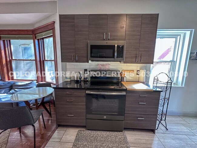 Building Photo - A home where old-world charm meets modern sophistication!