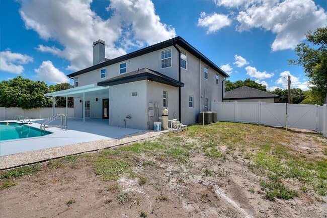 Building Photo - Rare Luxury Lease Opportunity | Spectacular 5-Bedroom Pool Estate on Nearly ¾ Acre Near Gulf Beaches