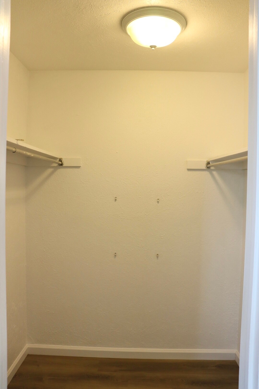 Primary bedroom walk-in closet. - 6396 E Mississippi Ave
