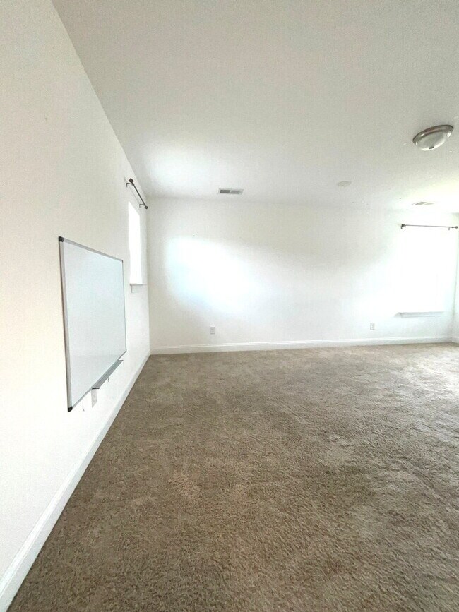 Building Photo - "Spacious 4-Bed Oasis with Stunning Lake V...