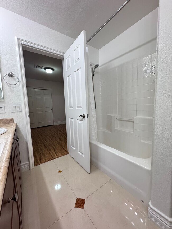 Building Photo - LUXURY LIVING • GOLF COURSE VIEW • GUARD-GATED COMMUNITY