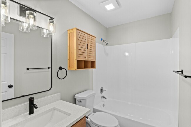 Step into elegance with this thoughtfully designed contemporary bathroom. - 5580 West 4th Avenue Townhomes