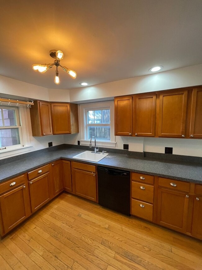 Building Photo - 3-Bedroom House with Theater-style Basement | Parking, Laundry, & Fenced Yard