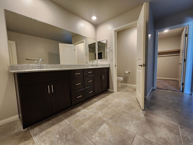 Building Photo - A Fairly New Home with 5 Bedrooms in a gated community