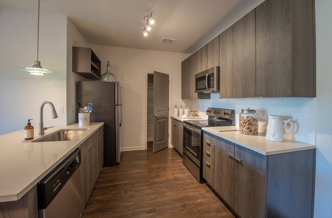 Kitchen with Updated Steel Appliances and Pantry - Ballpark Apartments @ Town Madison