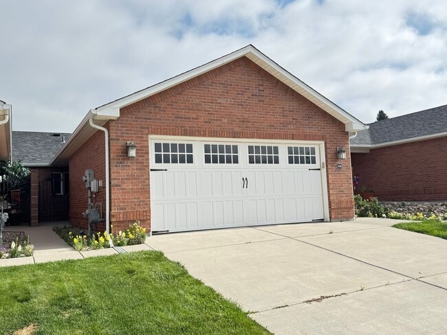 Building Photo - 4 BEDROOM, 3 BATHROOM TWINHOME WITH 2 CAR ATTACHED GARAGE IN NORTH CHEYENNE