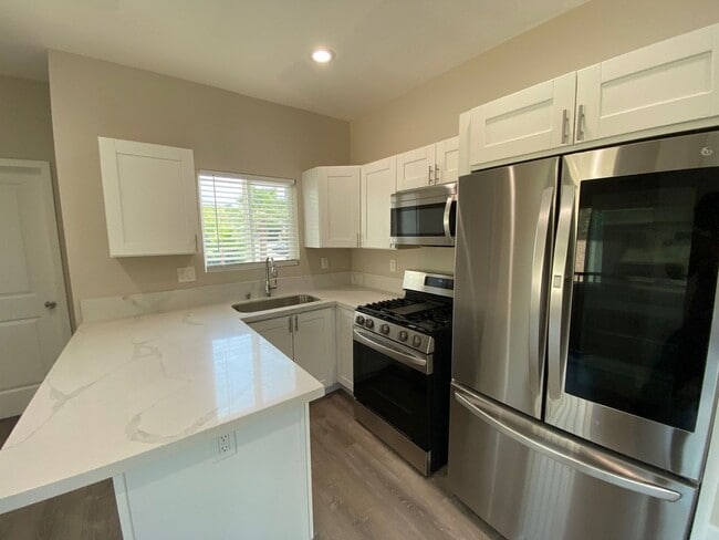 Building Photo - NEW (2023) 4BD/2BA!! Back gate exits right...