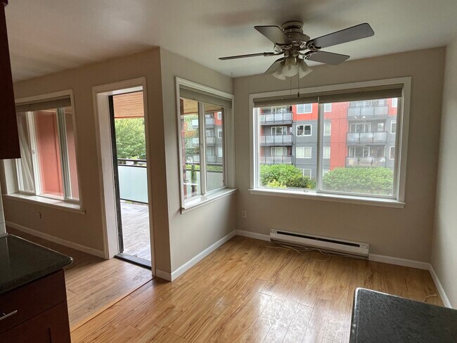 looking at dining area and balcony from kitchen. (facing west) - 7001 Sand Point Way NE