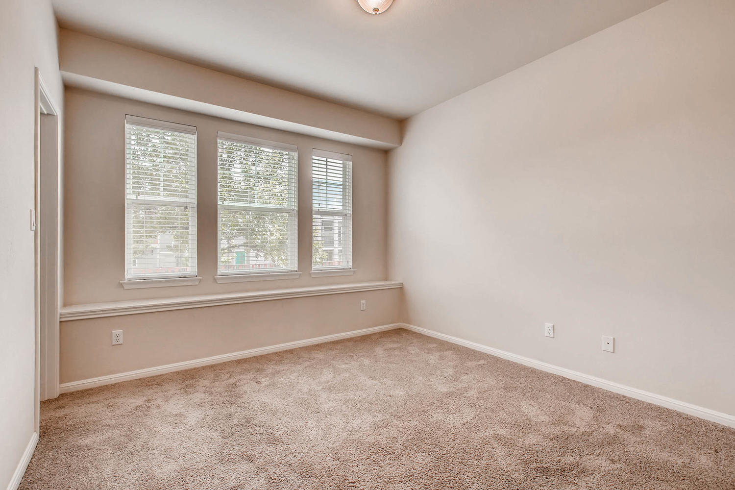 Downstairs bedroom with beautiful windows! - 1813 Carlson Drive