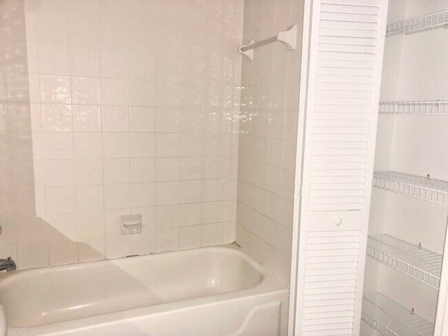 Building Photo - Nice 2X2 located on 2nd floor- Tile & lami...