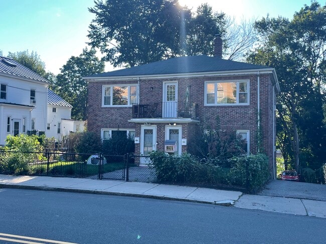 Brick house with garden and large front and back yard - 169 Foster St