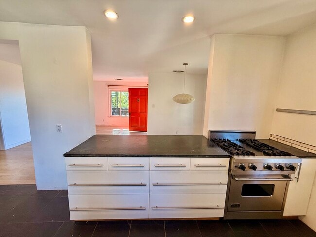 Building Photo - Hilltop Highland Park Sanctuary with Views, Private Gated Yard, In Unit Laundry, Parking & Abunda...