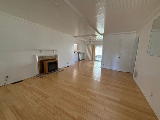 Building Photo - Hard floors, extra closets, patios & fence...