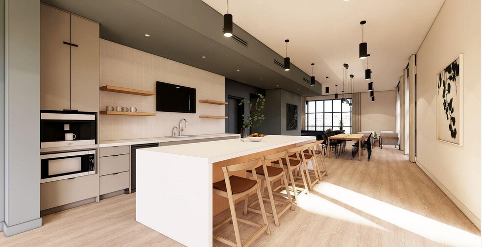 Experience luxury in a modern kitchen and dining area designed for social gatherings and family meals. - The 1785 Club Athens