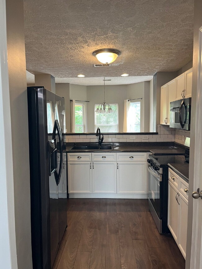 Building Photo - "Spacious 3-Bedroom Townhouse Retreat with Fireplace & Hardwood Floors in Antioch!"