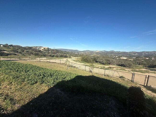 Building Photo - 4BR/2BA HOME w/ attached garage, usable land, fenced in back yard in CAMPO available!