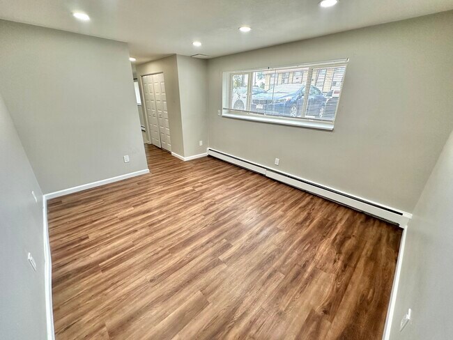 Experience elegance and comfort in this sunlit living space, perfect for relaxation and entertainment. - Country Club