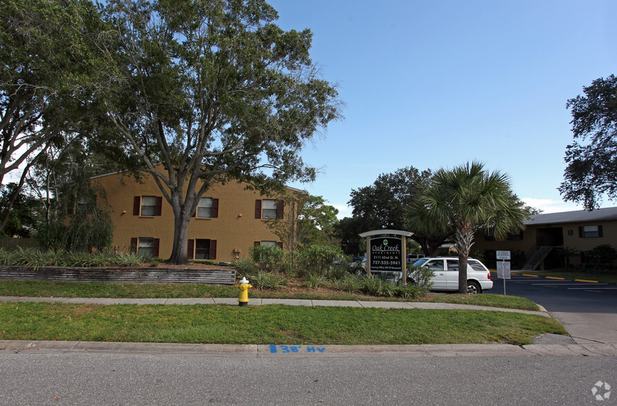 Building Photo - The Apartments at Oak Creek