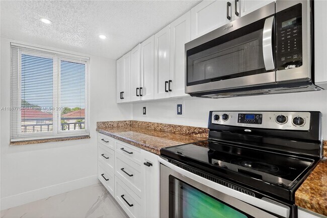 Building Photo - 9915 W Okeechobee Rd