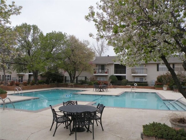 Large swimming pool next to condo - 3200 W Britton Rd