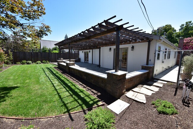 Patio with French doors from primary suite and family room - 1287 Westwood St