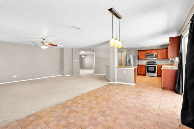 Building Photo - "2 WEEKS FREE! Spacious 4-Bedroom Sanctuary with 3 Full Baths and Solar Panels!"