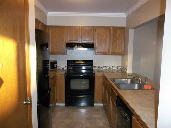 Building Photo - $500 OFF First Month | Charming 2BR Townhome with Garage