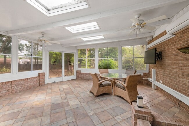 Building Photo - Spacious 3BR Retreat with Soaring Ceilings & Screened Porch