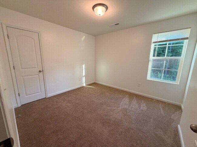 Building Photo - Available Now – Spacious 4BR Home on 1.5 Acres in Rural Hall!