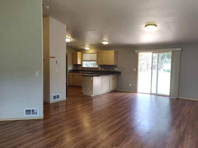 Building Photo - Charming 4-Bedroom Home on 1/2 Acre with a Fenced Backyard, Fully Insulated Double-Car Garage, in...