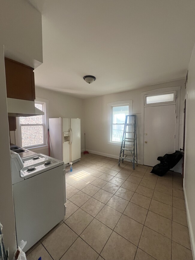 Kitchen. Back door to enclosed porch - 4321 W Thomas St