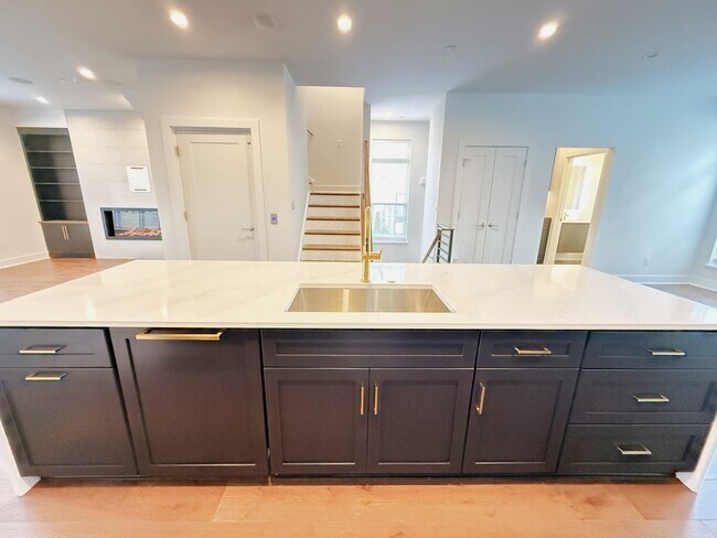 Building Photo - Brand new 4 level, 4 Bedroom Townhome with Elevator!