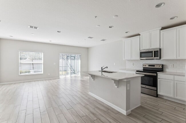 Building Photo - Stunning 3 bedroom, 2.5 bathroom townhome located in a highly desirable gated community